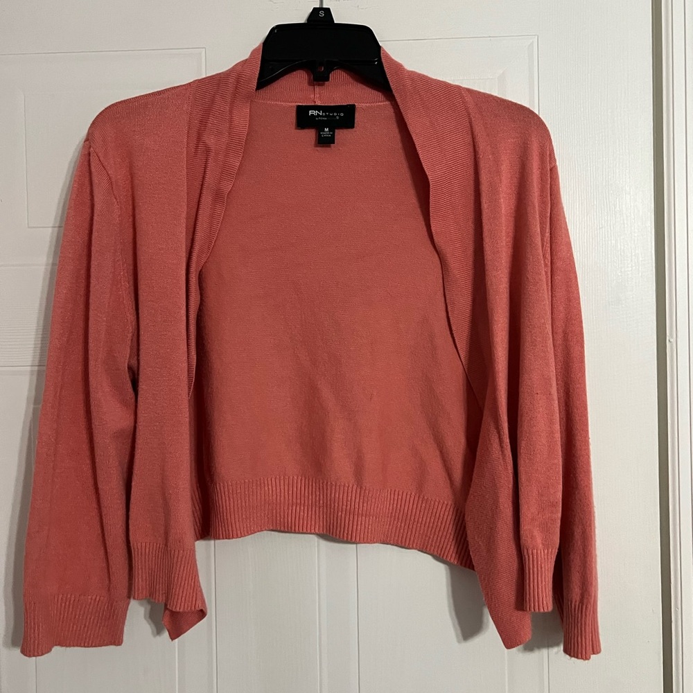 a cute, quarter inch sleeve, salmon/pink sweater